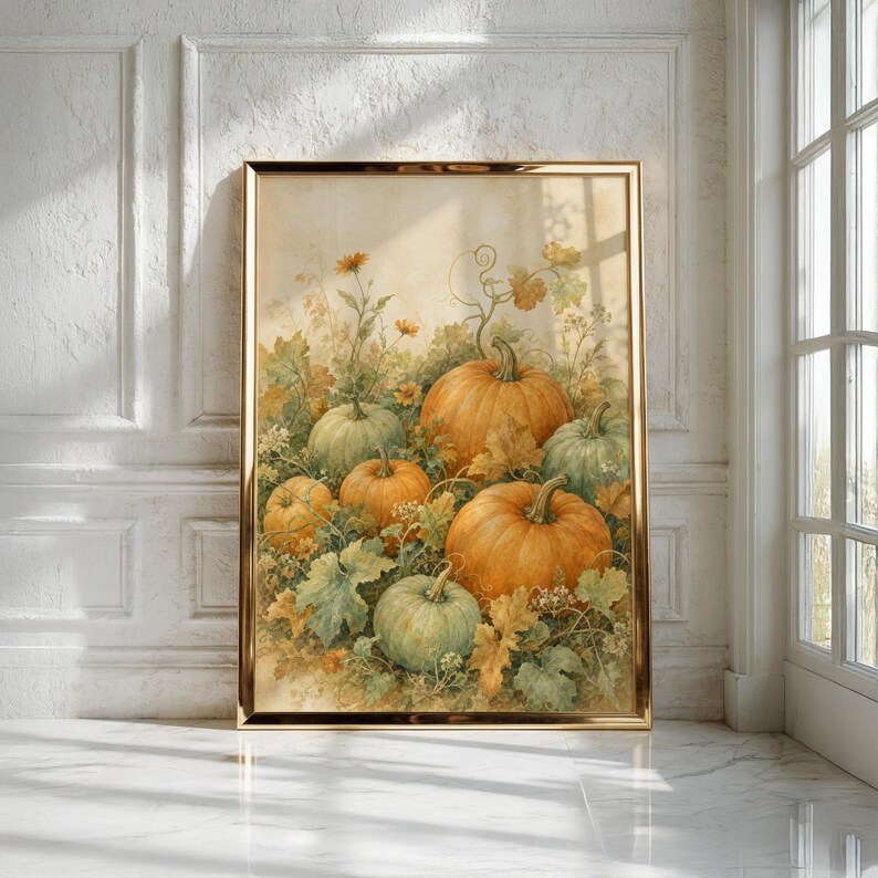 May include: A framed wall art print featuring a watercolor-style illustration of multiple pumpkins in shades of orange and sage green, surrounded by detailed foliage, vines, and small flowers against a soft, neutral, cream-colored background.