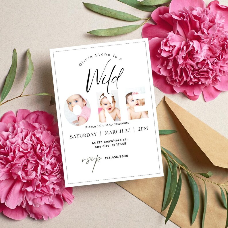 May include: A white invitation card with the text "Olivia Stone is a Wild One" and three baby photos. The card includes event details: Saturday, March 27, 2 PM, and an RSVP number. Pink peonies and a brown envelope are in the background.