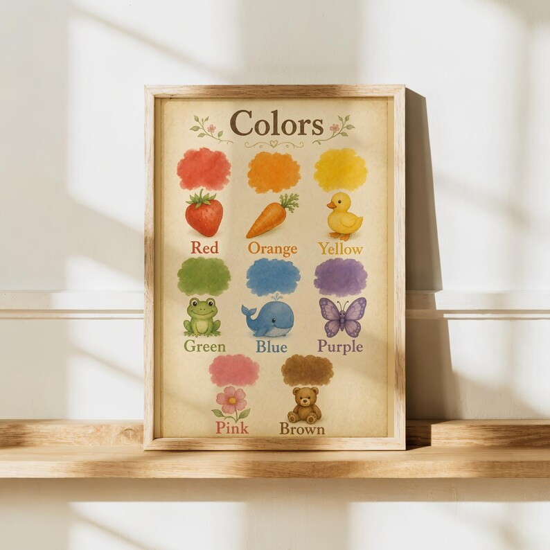 May include: A framed educational wall art print titled Colors, featuring watercolour illustrations of a red strawberry, orange carrot, yellow duck, green frog, blue whale, purple butterfly, pink flower, and brown teddy bear on a beige background.