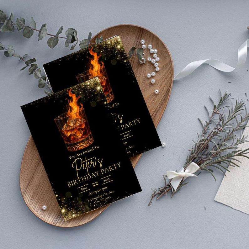 May include: Black and gold birthday party invitation with a glass of whiskey on fire. The text reads "You are invited to Peter's Birthday Party June 22, 2023 at 07:00 pm 123 Anywhere St. Any City, ST 12345".