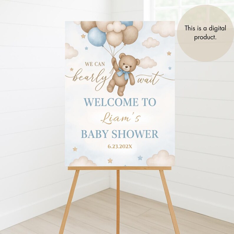 May include: A blue and brown baby shower welcome sign with a teddy bear holding balloons. The sign says "We can barely wait" and "Welcome to Liam's Baby Shower".