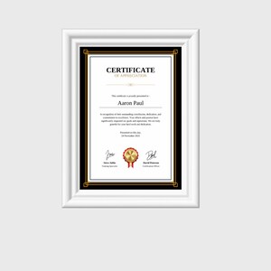 May include: A black and gold certificate of appreciation presented to Aaron Paul. The certificate is framed with a black border and gold accents. The text reads "Certificate of Appreciation" and "Presented on this day, 24 November 2021".