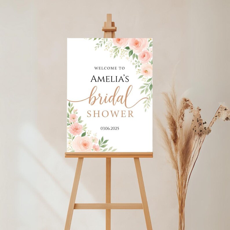Bridal shower welcome sign with blush pink roses, soft greenery, and elegant fonts. Features bride’s name and date. Perfect for spring or romantic bridal themes, editable in Canva.