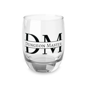 May include: A clear glass tumbler with a black design that says "DM" with the words "Dungeon Master" underneath.