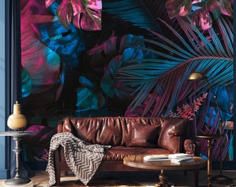 May include: A brown leather sofa with a throw blanket and a coffee table in front of it. The wall behind the sofa is covered in a tropical-themed wallpaper with large leaves in shades of pink, blue, and green.
