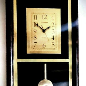 Canon Quartz Wall Clock – Dark Wood Frame, Gold Pendulum, Mid-Century Style