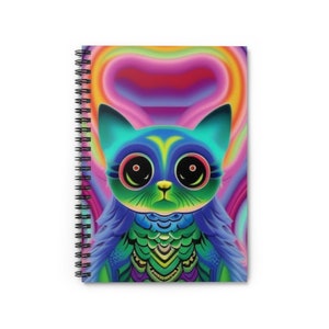 May include: Spiral-bound notebook with a colourful cartoon cat illustration. The cat has large eyes and is depicted in blue, green, and yellow against a rainbow backdrop. The notebook's design is striking and whimsical, perfect for notes or sketches.