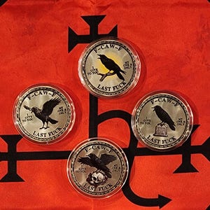 May include: Four circular silver-toned coins encased in clear protective capsules. Each coin features a black raven illustration, the text F-CAW-F, I GIVE TO YOU, MY ONE & ONLY, and LAST FUCK, with varying imagery of a sun, a tombstone, or a skull.