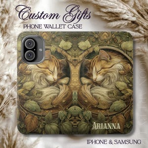 May include: A phone wallet case featuring a detailed illustration of two sleeping cats surrounded by leaves and foliage. The case has the text "Custom Gifts" and "Phone Wallet Case" at the top, with the name "Arianna" at the bottom. Compatible with iPhone and Samsung.