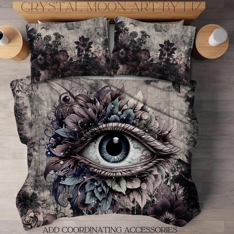 May include: A duvet cover with a large eye surrounded by flowers and leaves. The eye is blue with a black pupil. The background is a distressed gray and white pattern. The text "ADD COORDINATING ACCESSORIES" is at the bottom of the image.