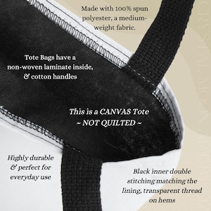 May include: Close-up of a white canvas tote bag with black handles and lining. The bag is made of spun polyester and has a non-woven laminate interior. Text on the bag reads: "This is a CANVAS Tote ~ NOT QUILTED ~" and "Highly durable & perfect for everyday use."