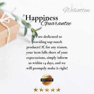 May include: Image features the text "Happiness Guarantee" with a gold seal that says "Guarantee". The text promises top-notch products and a 14-day return policy. A gift box and greenery are in the background.