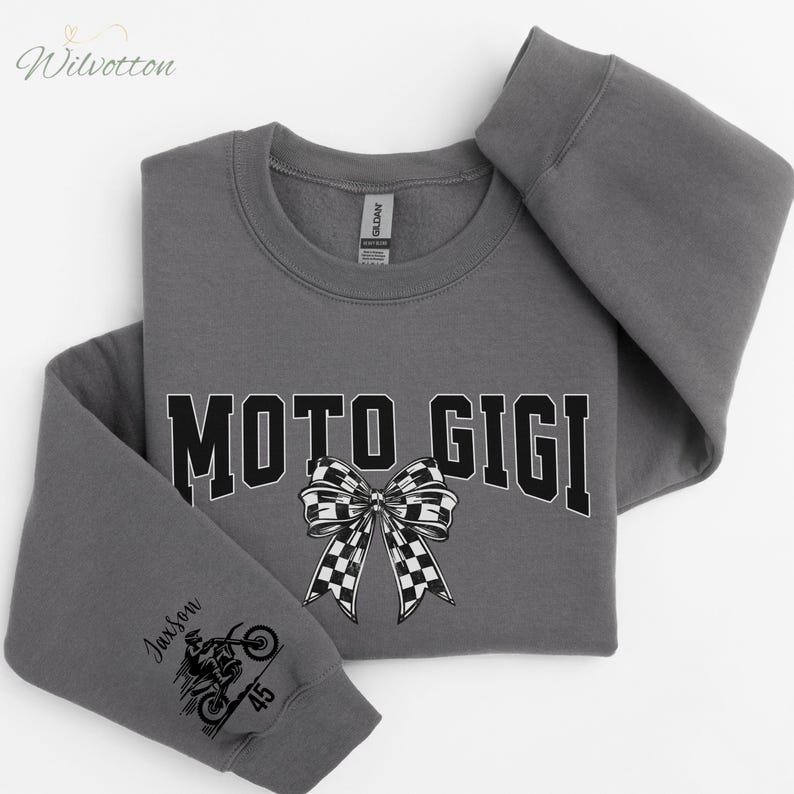 May include: A gray sweatshirt with the text "MOTO GIGI" in black block letters and a checkered bow graphic. The left sleeve features a motorcycle graphic and the name "Jaxson" with the number "45".