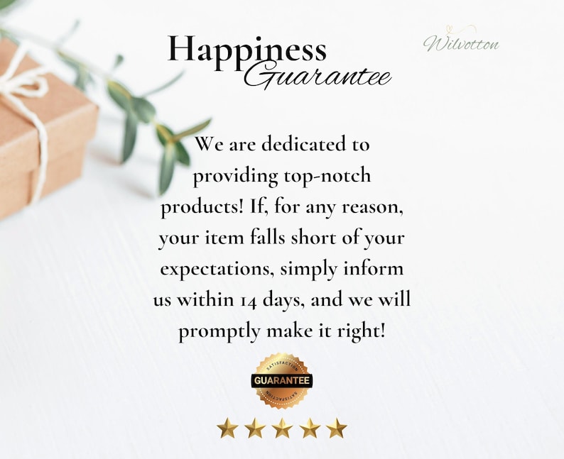 May include: A white informational card featuring the text Happiness Guarantee, followed by a paragraph stating dedication to quality and a 14-day return policy. The card includes a gold circular seal with the word GUARANTEE and five gold stars.
