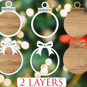 Puede incluir: Seis recortes de adornos navide&ntilde;os en varios dise&ntilde;os. Algunos adornos son de grano de madera maciza, mientras que otros tienen contornos blancos. Dos adornos presentan un dise&ntilde;o de lazo. El texto "2 LAYERS" est&aacute; en la parte inferior de la imagen.
