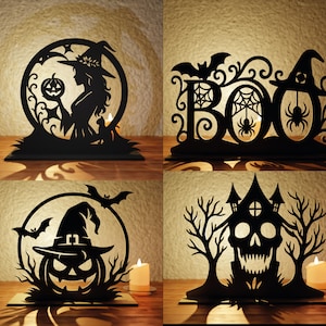 May include: Four black Halloween-themed decorations. One features a witch silhouette holding a pumpkin, another spells "BOO" with bats and spiders, a third has a jack-o'-lantern with a witch hat, and the last is a skull-shaped haunted house.