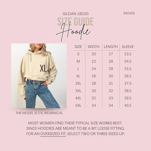 May include: Size chart for a Gildan 18500 hoodie in inches. The chart shows the width, length, and sleeve length for sizes S through 5XL. The model is wearing a size XL.