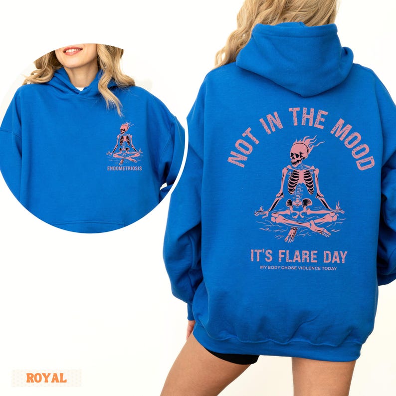unisex chronic illness hoodie in color Royal Blue. Back design: Graphic of a pink skeleton in flames with a phrase not in the mood its flare day in grunge font in pink. Pocket design: the same skeleton with the text Endometriosis