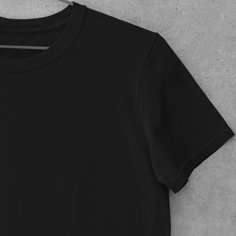 May include: A black short-sleeved t-shirt with a crew neck.