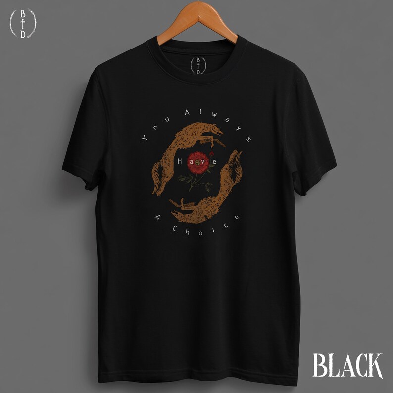 May include: Black t-shirt with a circular design featuring two hands, a red rose, and the text "You Always Have A Choice." The hands are brown, and the text is white. The word "BLACK" is printed in white at the bottom right.
