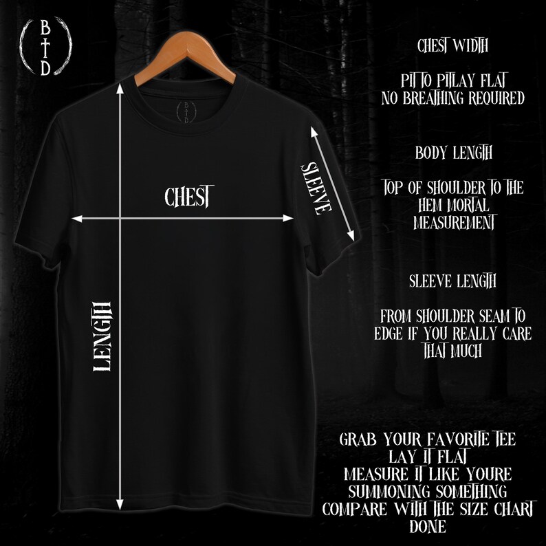 May include: Black t-shirt on a wooden hanger, with white text and measurement guides. The text includes "CHEST", "SLEEVE", and "LENGTH", along with instructions for measuring the shirt.