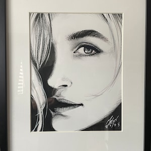 Framed original portrait of a blonde woman in black