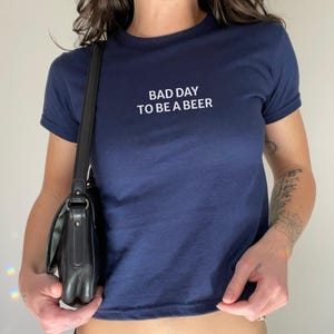 Bad Day to Be a Beer Baby Tee, Funny Drinking Shirt, 4th of July Outfit, USA Party Tee, Lake Day Shirt, Trendy Summer Graphic Tee, Baby Tee