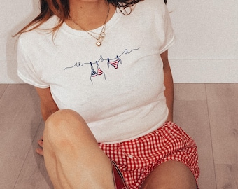 T-shirt bébé USA 4 juillet, t-shirt ligne de bikini patriotique, t-shirt graphique drapeau américain, tenue estivale pour la journée du lac, jolie chemise tendance américaine, bikini