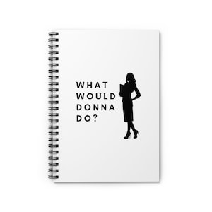 May include: A white spiral notebook with the text "WHAT WOULD DONNA DO?" in black. A black silhouette of a woman in a skirt and heels is standing to the right of the text, holding a folder.