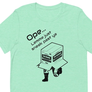 Solid Sneak: Metal Gear Solid T-shirt met 'Ope, Lemme Sneak Right Past Ya' met Solid Snake in een kartonnen doos