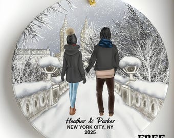 May include: A round Christmas ornament with a winter scene of a couple walking on a snowy bridge in New York City. The ornament has the text "Heather & Parker, New York City, NY 2025". A red "SALE" banner is at the top.