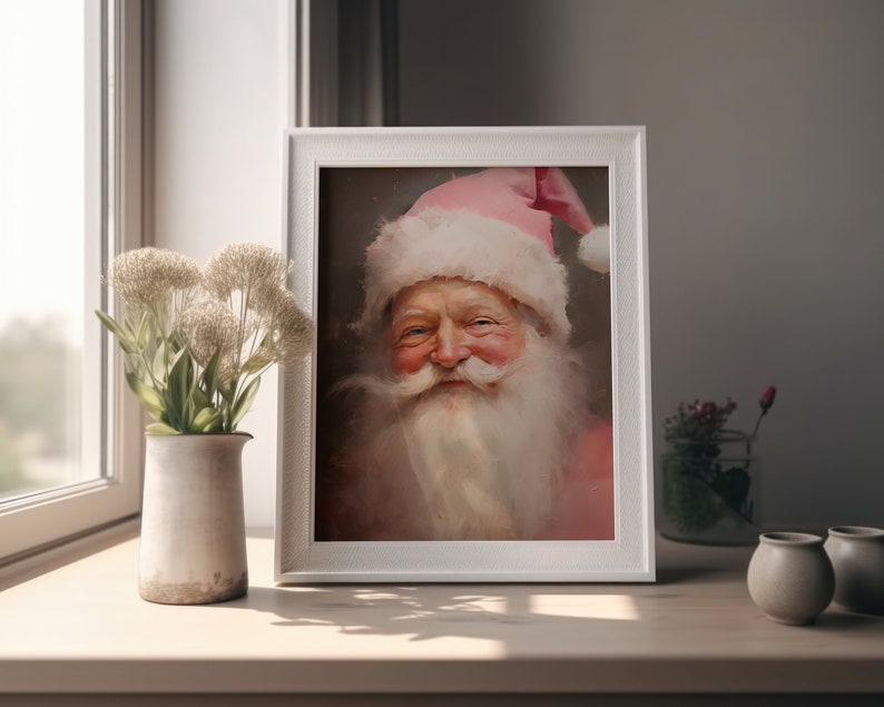 May include: A framed painting of Santa Claus with a pink hat and white beard. He is smiling and wearing a pink coat.