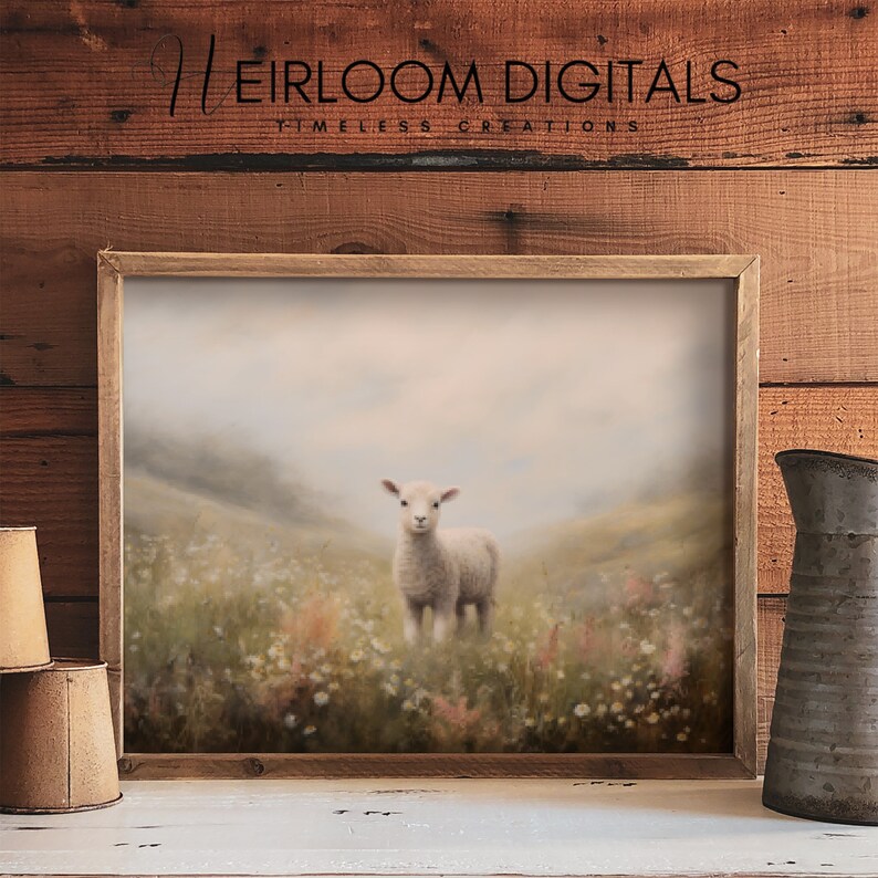 May include: A framed print featuring a lamb standing in a field of wildflowers. The artwork has a soft, muted color palette with a rustic wooden frame. The text "HEIRLOOM DIGITALS TIMELESS CREATIONS" is at the top.