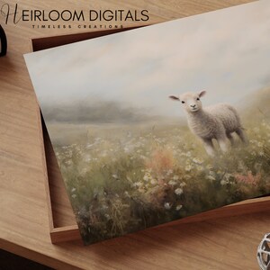 May include: A print featuring a lamb in a field of wildflowers. The lamb is white with a fluffy coat, standing in a meadow with daisies and tall grass. The print is in a wooden tray with the text "HEIRLOOM DIGITALS TIMLESS CREATIONS".