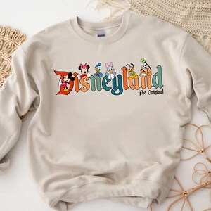 a sweatshirt with the word disneyland on it