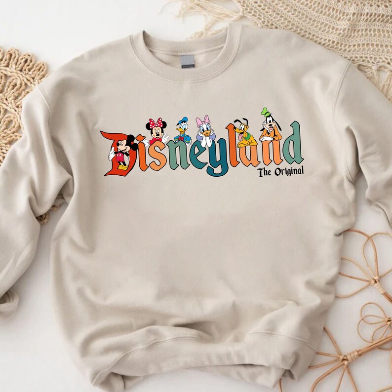 a sweatshirt with the word disneyland on it
