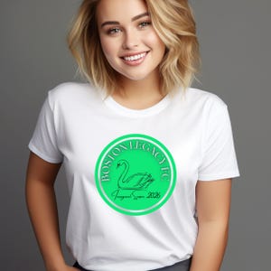 May include: White t-shirt featuring a green and silver circular logo with the text "BOSTON LEGACY FC" and a swan illustration. The text "Inaugural Season 2026" is also included in the design.