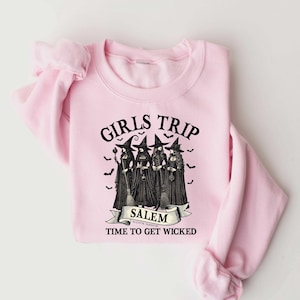 May include: Pink sweatshirt with a black graphic of four witches with the text "Girls Trip Salem Time to Get Wicked".
