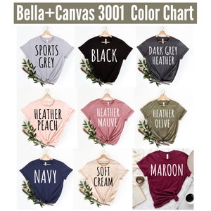 May include: Color chart showing Bella+Canvas 3001 t-shirt colors. The colors are: Sports Grey, Black, Dark Grey Heather, Heather Peach, Heather Mauve, Heather Olive, Navy, Soft Cream, and Maroon.