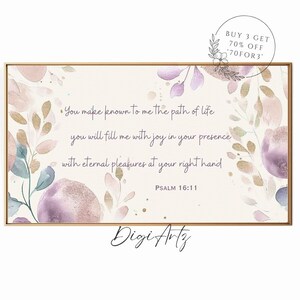 Puede incluir: Una pintura de acuarela con un diseño floral en tonos de rosa, morado y dorado. La pintura presenta una cita del Salmo 16:11, "Tú me haces conocer el camino de la vida, me llenas de alegría en tu presencia, de alegrías eternas a tu derecha." La pintura está enmarcada en un marco dorado.