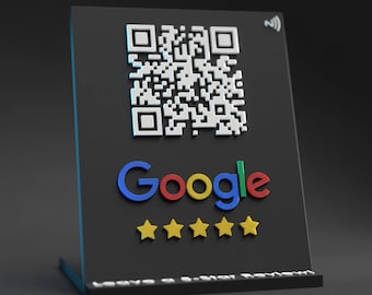 May include: A black sign with a white QR code, the word "Google" in colorful letters, and five yellow stars. The sign says "Leave a Google Review".