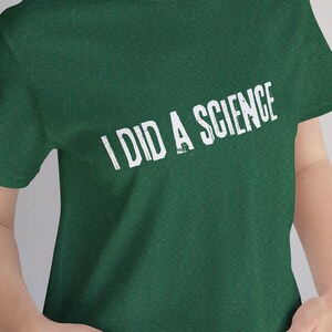 May include: A green t-shirt with the text "I DID A SCIENCE" in white.