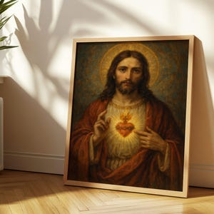 May include: A framed religious portrait depicts a man with long brown hair and a beard, wearing a red robe. A glowing heart is visible on his chest. The artwork is set against a dark background with a golden halo.