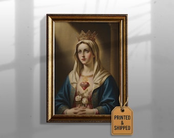 May include: A framed portrait of a woman wearing a crown and a blue cloak. The painting features a heart with a flame and white roses. The frame is gold with a detailed border. The tag on the frame says "PRINTED & SHIPPED".