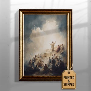 May include: A framed print of a religious scene. The artwork depicts a figure with outstretched arms atop a cloud, surrounded by a crowd. The frame is gold-colored, and a tag that says "PRINTED & SHIPPED" is attached.