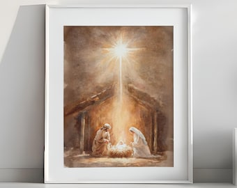 May include: Watercolor painting of the Nativity scene, framed in white. The artwork depicts Mary, Joseph, and baby Jesus in a manger, illuminated by a bright star. The color palette is warm, with earthy tones and a soft, ethereal glow.