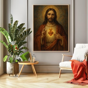 May include: A framed religious artwork depicting Jesus Christ with a golden halo and a glowing heart. The painting is in a room with a plant, a small table, a chair, and an orange throw blanket.