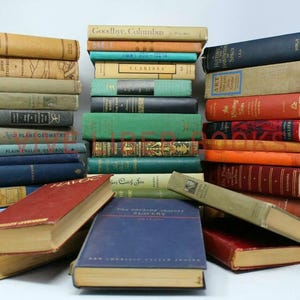 May include: A collection of vintage books with various colors and sizes. The books are stacked in multiple piles, showcasing their aged covers and spines. The color palette includes shades of blue, green, red, and tan, creating a visually rich display of literature.