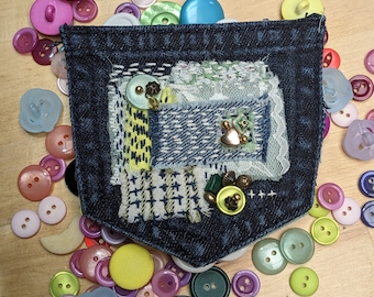 Distressed fabric recycled denim pocket patch. Boro Sashiko slow stitched wearable art.