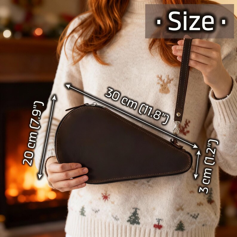 May include: A brown leather clutch with a zipper closure and a wrist strap. The clutch measures 11.8 inches long, 7.9 inches wide, and 1.2 inches thick. The word "Size" is displayed at the top of the image.